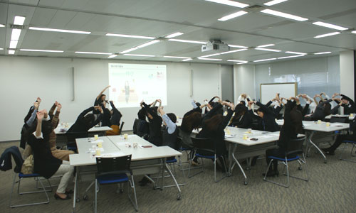 Participants engage in stretching at FYE2019 Seminar for Healthy Working Women